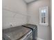 Well-lit laundry room with modern washer and dryer, complete with an overhead shelf at 2880 Stonehall Ct # 2, Atlanta, GA 30339