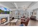 Cozy living room featuring fireplace, coffered ceilings, and plantation shutters at 2880 Stonehall Ct # 2, Atlanta, GA 30339