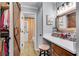 Bathroom with modern vanity, wood accents, and unique sliding door to the closet at 3655 Habersham Ne Rd # B148, Atlanta, GA 30305