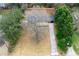 Aerial view of the property showing the home, driveway, and surrounding trees at 1120 Taliwa Ne Trl, Marietta, GA 30068