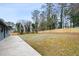 Spacious backyard features a large grassy area and newly installed natural wood fence at 1120 Taliwa Ne Trl, Marietta, GA 30068