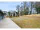 Expansive backyard features a concrete patio and a new wood fence at 1120 Taliwa Ne Trl, Marietta, GA 30068