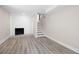 Finished basement space with modern flooring, fireplace, and staircase at 1120 Taliwa Ne Trl, Marietta, GA 30068
