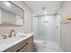 Modern bathroom featuring a walk-in shower with glass doors and upscale gold hardware at 1120 Taliwa Ne Trl, Marietta, GA 30068