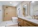 Bright bathroom featuring double sink vanity, freestanding tub, and luxurious gold hardware at 1120 Taliwa Ne Trl, Marietta, GA 30068