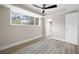 Bedroom with new LVP floors, neutral walls, white trim and a ceiling fan at 1120 Taliwa Ne Trl, Marietta, GA 30068