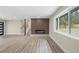 Open concept living area with fireplace, staircase, recessed lighting, and lots of natural light at 1120 Taliwa Ne Trl, Marietta, GA 30068