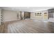 Living room with fireplace, modern floors, staircase, open floorplan, and access to the kitchen at 1120 Taliwa Ne Trl, Marietta, GA 30068
