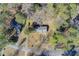 Aerial view showcasing the property's layout within a neighborhood with tree coverage at 170 Roberts Rd, Covington, GA 30016