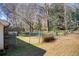 Fenced backyard with mature trees and potential for outdoor enjoyment and activities at 170 Roberts Rd, Covington, GA 30016