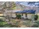 View of the home's backyard and exterior featuring a well-maintained lawn and chain link fence at 170 Roberts Rd, Covington, GA 30016