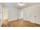 Well-lit bedroom with hardwood floors, closet, and access to an ensuite bathroom at 170 Roberts Rd, Covington, GA 30016
