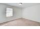 Bedroom featuring neutral carpet and ample natural light from the window at 170 Roberts Rd, Covington, GA 30016
