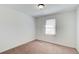 Bedroom featuring carpet, window, and a neutral color scheme at 170 Roberts Rd, Covington, GA 30016