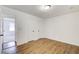 Bright bedroom with hardwood floors, closet, and a neutral color scheme at 170 Roberts Rd, Covington, GA 30016
