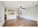 Open living room showcasing hardwood floors, a ceiling fan, and seamless flow into the kitchen area at 170 Roberts Rd, Covington, GA 30016