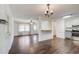 Inviting living room with hardwood floors, a view of the kitchen, and great natural light at 170 Roberts Rd, Covington, GA 30016