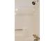 Shower stall featuring a built-in seat and updated shower head fixtures at 170 Roberts Rd, Covington, GA 30016
