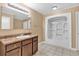 Bathroom featuring a single sink vanity, tile flooring and a bath tub with shower at 4227 Midway Rd, Douglasville, GA 30134