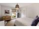 Bright bedroom with a woven pendant light, a dresser, and a window at 4865 Northway Dr, Atlanta, GA 30342