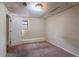 Cozy bedroom with a window and carpeted flooring at 123 Williamsburg Ln, Woodstock, GA 30189