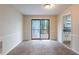 Dining room with a sliding glass door to the deck, and a view into the kitchen area at 123 Williamsburg Ln, Woodstock, GA 30189