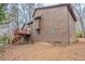 The exterior of this home features a two story house with a small wooden deck at 123 Williamsburg Ln, Woodstock, GA 30189