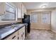 Functional kitchen featuring stainless steel appliances, ample counter space, and bright natural light at 123 Williamsburg Ln, Woodstock, GA 30189