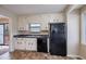 Clean kitchen with modern appliances, featuring white cabinets and tiled floor at 123 Williamsburg Ln, Woodstock, GA 30189