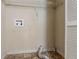 Utility room with vinyl flooring, washer hookups, dryer connection, and overhead shelving at 123 Williamsburg Ln, Woodstock, GA 30189