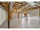 Spacious unfinished basement with wooden beams and columns, showing potential for future customization at 211 Garden W Walk, Hampton, GA 30228