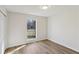 Bedroom with natural light, hardwood floors, and a window at 211 Garden W Walk, Hampton, GA 30228