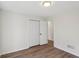 Bedroom featuring neutral walls, hardwood floors, and a closet at 211 Garden W Walk, Hampton, GA 30228