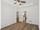 Dining area featuring crown molding, wood floors, and an open view to the kitchen at 211 Garden W Walk, Hampton, GA 30228