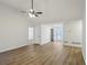 Bright living room showcasing vaulted ceilings, wood floors, and natural light at 211 Garden W Walk, Hampton, GA 30228