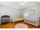 Comfortable bedroom with light gray walls, a ceiling fan, and a round rug at 301 Madison Se Ct, Smyrna, GA 30080