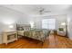 Cozy bedroom with hardwood floors, ceiling fan, and natural light at 301 Madison Se Ct, Smyrna, GA 30080