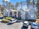 Beautiful condominium complex featuring stone accents, private balconies, and ample parking for residents and guests at 301 Madison Se Ct, Smyrna, GA 30080