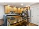 This spacious kitchen features stainless steel appliances and a large island with seating at 301 Madison Se Ct, Smyrna, GA 30080