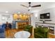 View of living room with hardwood floors, an open floor plan, and a breakfast bar at 301 Madison Se Ct, Smyrna, GA 30080