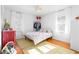 Serene bedroom with light hardwood floors, minimal decor, and large windows for natural light at 3140 Westmart Ln, Atlanta, GA 30340