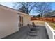 Relax on this outdoor deck featuring two rocking chairs and views of the surrounding fenced yard at 3140 Westmart Ln, Atlanta, GA 30340