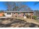 Traditional home with brick accents and a neatly landscaped front lawn at 3140 Westmart Ln, Atlanta, GA 30340