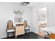 Bright kitchen area with black floors, eating nook, and access to a living space at 3140 Westmart Ln, Atlanta, GA 30340