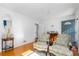 Bright living room with hardwood floors, stylish seating, and a view of the entry at 3140 Westmart Ln, Atlanta, GA 30340