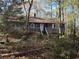 Exterior view of a one-story home featuring wood siding, porch and a chimney at 6575 Riley Rd, Cumming, GA 30028