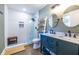 Modern bathroom featuring a tiled walk-in shower, double vanity, and decorative ladder shelving at 2174 Juanita St, Decatur, GA 30032