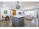 Kitchen island opens to dining and living area, featuring seating and ample storage at 2174 Juanita St, Decatur, GA 30032