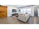 Bright and airy living room featuring a comfortable sofa, large windows, and a rustic barn door at 2174 Juanita St, Decatur, GA 30032