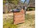 Modern wooden mailbox with sleek black numbers against a leafy front yard backdrop at 2174 Juanita St, Decatur, GA 30032